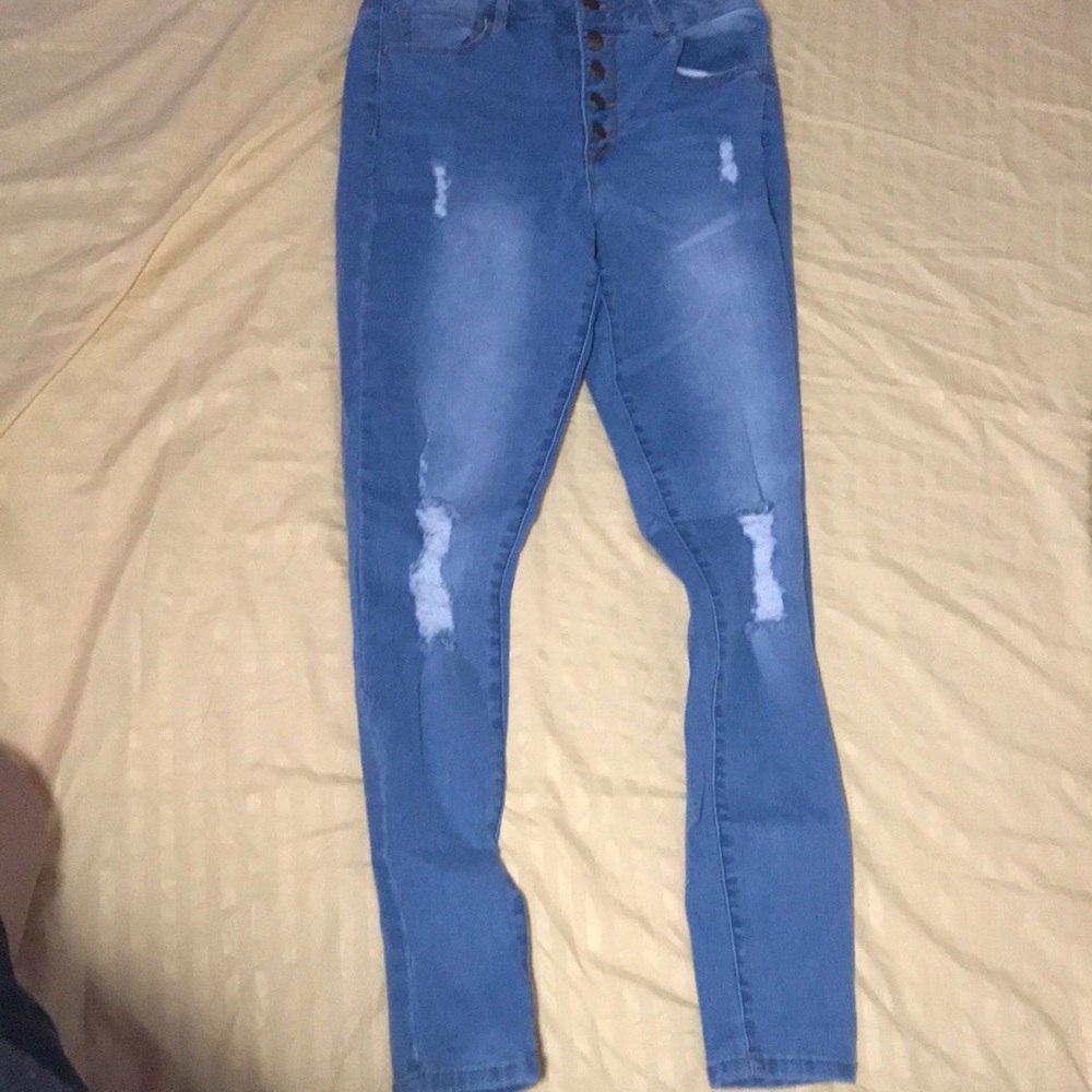 Ripped high rise light wash jeggings.